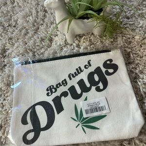 White and black canvas pouch with "bag full of drugs" print #festival #r…